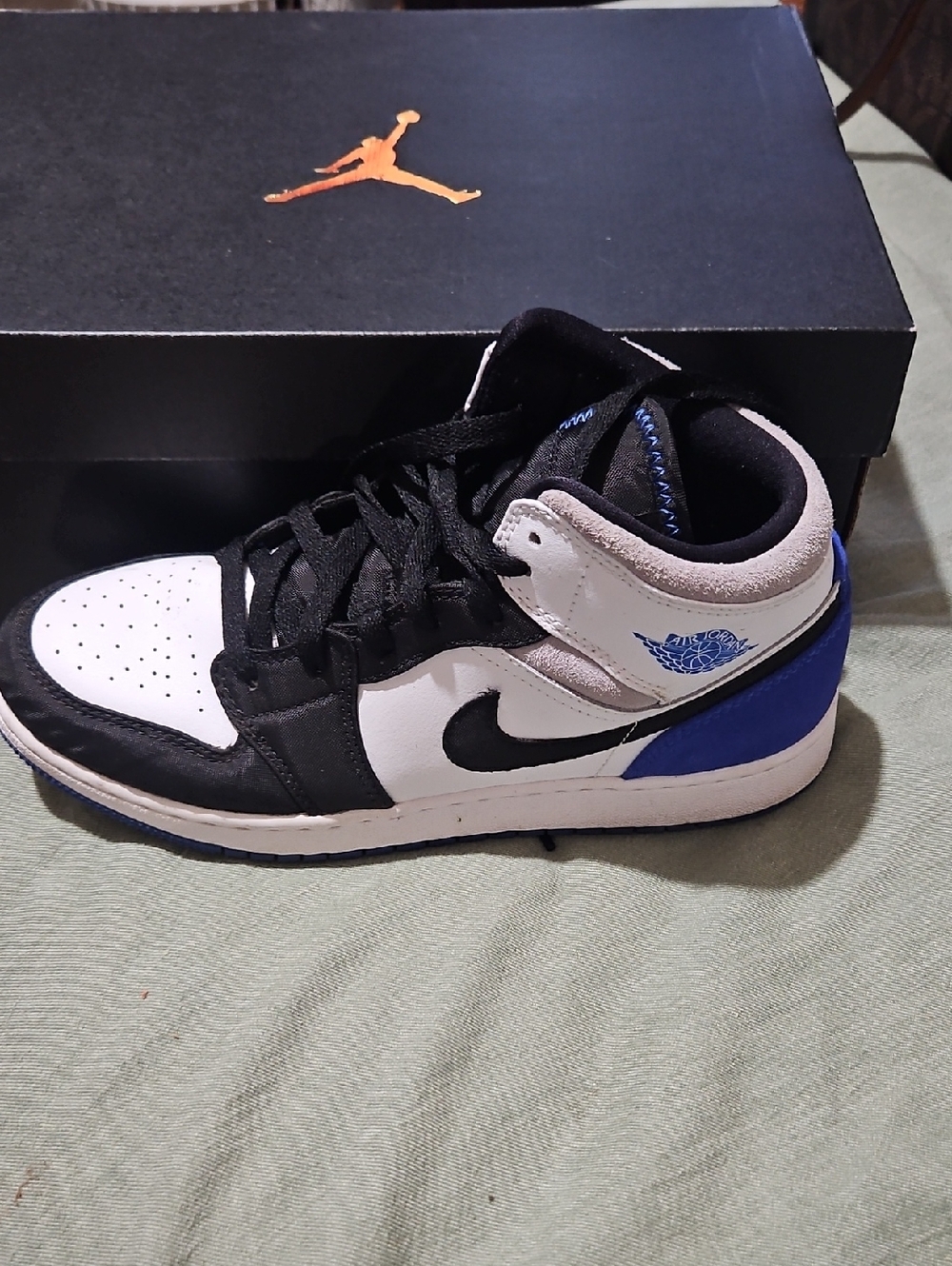 Nike Air Jordan 1 Mid Black White and Royal Blue Accent